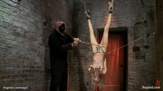 Skinny blond in upside down suspension