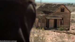 Hunter tormets slaves in the desert