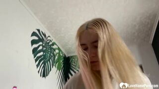 Blonde chick is on her knees & giving a blowjob