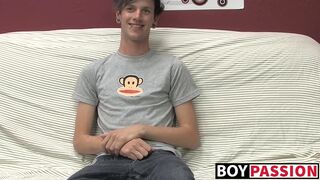 Cute gay guy Danny jerks off his cock on couch solo
