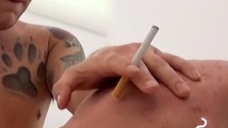 Seductive tattooed hunks blows his cigar while he cums